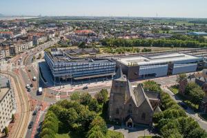 an aerial view of a city with a church at ibis budget Blankenberge in Blankenberge