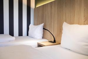 ACHAT Hotel Stuttgart Zuffenhausen 객실 침대
