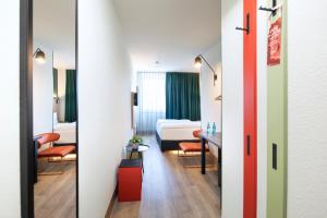 ACHAT Hotel Stuttgart Zuffenhausen 객실 침대