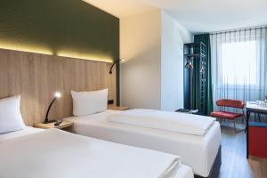 ACHAT Hotel Stuttgart Zuffenhausen 객실 침대