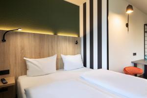 ACHAT Hotel Stuttgart Zuffenhausen 객실 침대