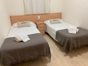 Postel nebo postele na pokoji v ubytování Apartaments Flamingo