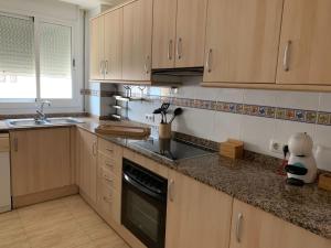 Kuchyň nebo kuchyňský kout v ubytování Apartaments Flamingo