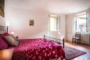 Postel nebo postele na pokoji v ubytování VECCHIO BORGO