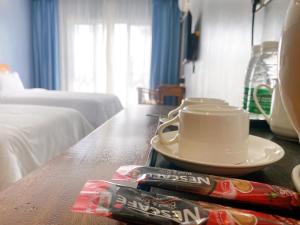 Postel nebo postele na pokoji v ubytování Junlan Hotel