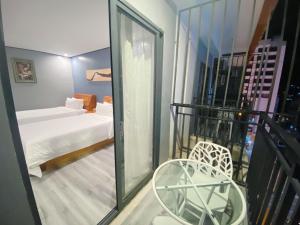 Postel nebo postele na pokoji v ubytování Junlan Hotel
