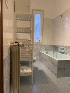 a bathroom with a bunk bed and a bath tub at Ca' ToscaLina in Carrara