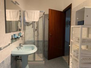 a bathroom with a sink and a shower at Ca' ToscaLina in Carrara