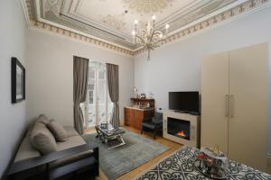 a living room with a couch and a fireplace at The Story Hotel Pera in Istanbul