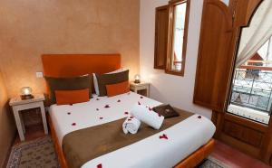 Vuode tai vuoteita majoituspaikassa Riad l'Heure d'Eté