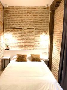 Tempat tidur dalam kamar di Lauramer Casco Viejo