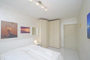 Ένα ή περισσότερα κρεβάτια σε δωμάτιο στο Casa Rudi - Gardagate +34 φωτογραφίες