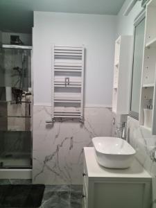 Kúpeľňa v ubytovaní APARTAMENT CENTRUM OLSZTYNA 2