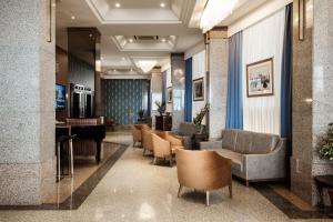 a lobby with chairs and a waiting room at The Diplomat Hotel in Sliema