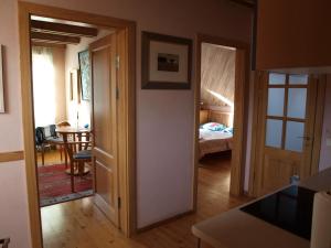 a room with a door leading to a bedroom at Aika in Nida