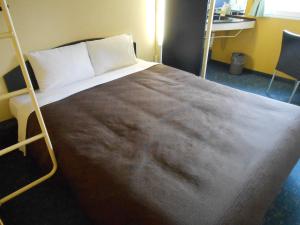 เตียงในห้องที่ Select Inn Numazu