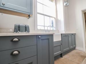 a kitchen with a sink and a window at Windyridge in Settle +32 photos