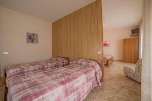 a hotel room with two beds and a tv at Hotel Santa Maria in Assisi +28 photos