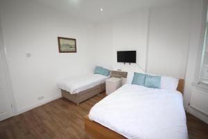 Llit o llits en una habitació de Harlesden Road Place