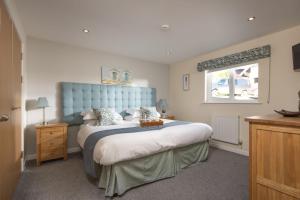 Postel nebo postele na pokoji v ubytování Lodge 40, Retallack Resort & Spa