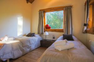 Un pat sau paturi într-o cameră la Al pie del Campanario