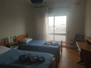 Postel nebo postele na pokoji v ubytování Foz do Guadiana