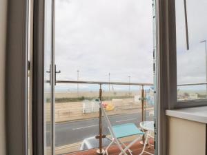 a room with a window with a view of a street at The Beach House in Cleveleys