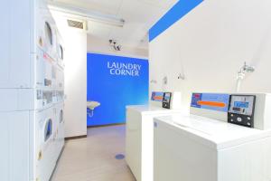 a room with a laboratory with a washing machine at HOTEL MYSTAYS Asakusa in Tokyo