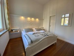 
Ein Bett oder Betten in einem Zimmer der Unterkunft Villa Pension Strandhaus - adults only
