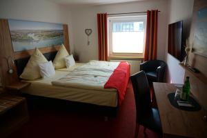 Postel nebo postele na pokoji v ubytování Hotel Jan van Werth