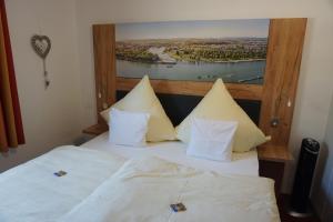 Postel nebo postele na pokoji v ubytování Hotel Jan van Werth