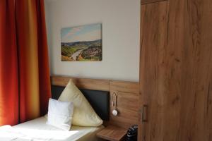 Postel nebo postele na pokoji v ubytování Hotel Jan van Werth