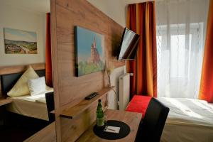 TV a/nebo společenská místnost v ubytování Hotel Jan van Werth