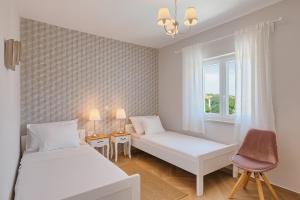 Postel nebo postele na pokoji v ubytování Villa Mokka - Perfekt ausgestattete Villa in hervorragender Lage + 37 fotografií