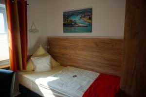 Postel nebo postele na pokoji v ubytování Hotel Jan van Werth