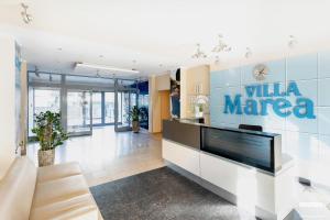Televízia a/alebo spoločenská miestnosť v ubytovaní Apartamenty Villa Marea Misdroy by Noclegi Renters