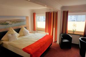 Postel nebo postele na pokoji v ubytování Hotel Jan van Werth