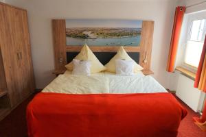 Postel nebo postele na pokoji v ubytování Hotel Jan van Werth