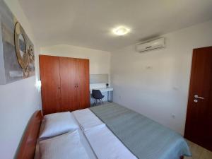 Postel nebo postele na pokoji v ubytování Apartments Amfora