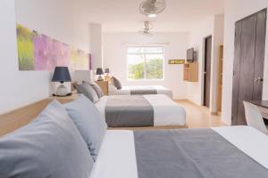 Postel nebo postele na pokoji v ubytování Hotel Plataneras Plaza