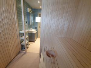 a bathroom with a toilet in the middle of a room at Viste Funäsdalen in Funäsdalen +157 photos