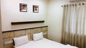 Postel nebo postele na pokoji v ubytování Hotel City Inn