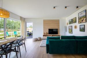 TV a/nebo společenská místnost v ubytování Apartament Kolory Ziemi