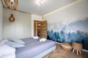 Postel nebo postele na pokoji v ubytování Apartament Kolory Ziemi