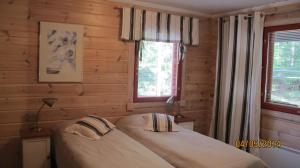 Postel nebo postele na pokoji v ubytování Lomakulkuri Apartments