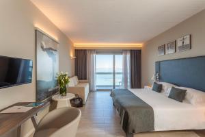 a hotel room with a bed and a television at Nautilus Family Hotel in Pesaro