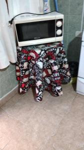 a toaster oven sitting on a table in a kitchen at Departamento E.M.A in Esquel