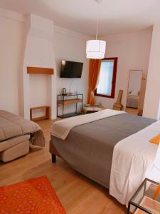 A bed or beds in a room at Ca' Palazzo
