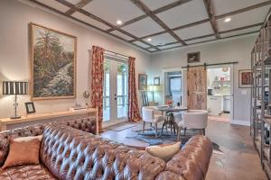 a living room with a couch and a table at Peaceful Gem Near Cloudland Canyon State Park in Rising Fawn