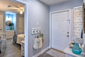 a room with a white door and a bedroom at Ocean-View Balcony: Family Gem on Seawall Blvd! in Galveston +20 photos
